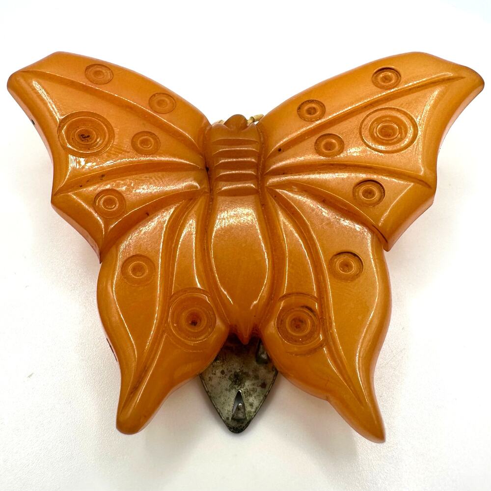 Antique vintage carved butterscotch yellow Bakelite butterfly dress clip brooch